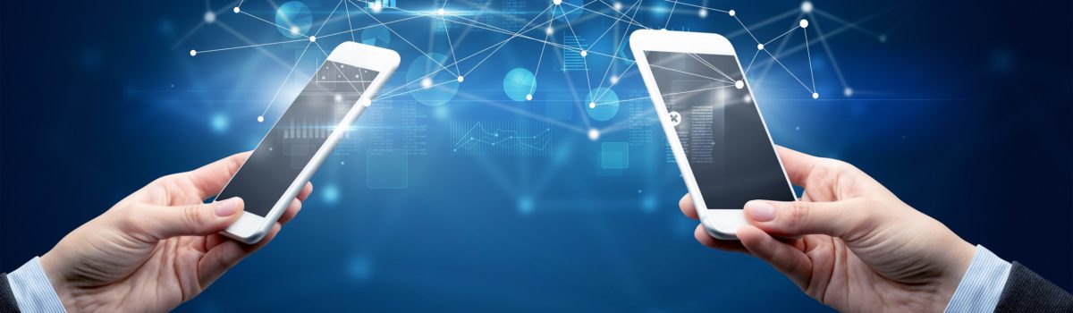 Close up of two hands holding smartphones and sharing business data